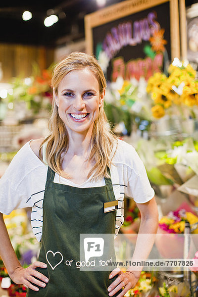 Grocer smiling in florist section