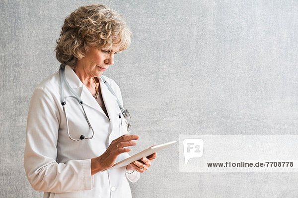 Female doctor using at digital tablet
