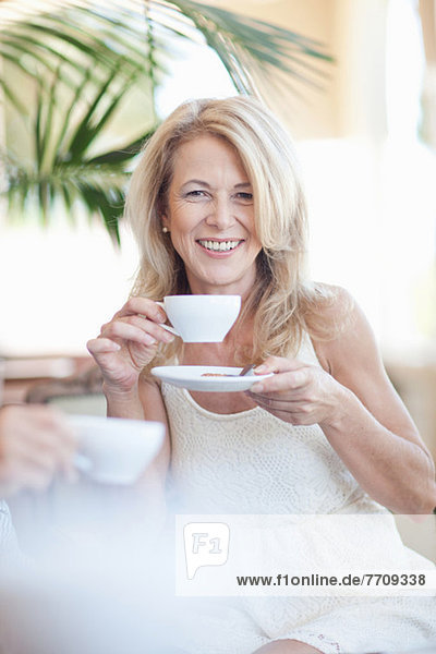 Older woman having cup of coffee