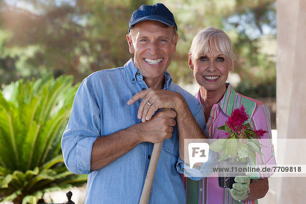 Older couple gardening together