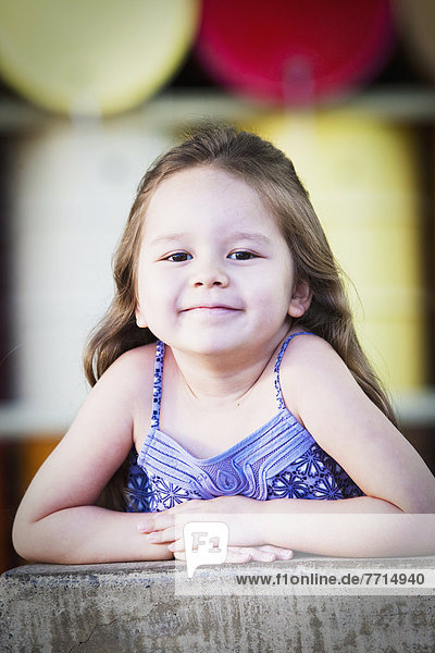 A Five-Year-Old Girl Smiles Happily For The Camera  Costa Mesa California Usa