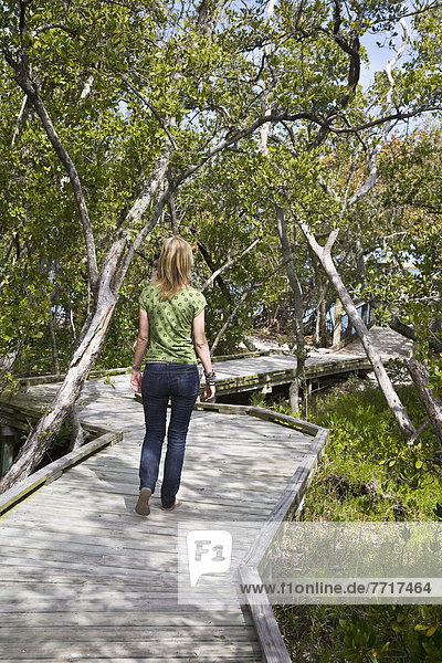 Woman On Boardwalk At Quick Point Nature Trail