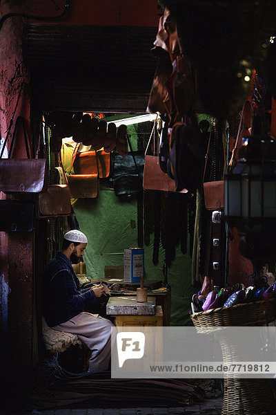 Man Making Handbags From Leather In Souk  Marrakesh  Morocco