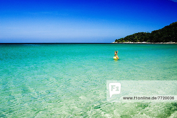 Thailand  Phuket  Karon Beach  Woman With Mask And Snorkel In Bright Clear Tropical Water.