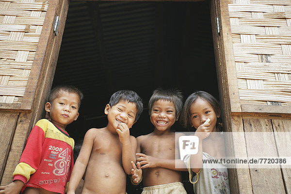 Children Laughing In Doorway  Bolaven Plateau  Champasak Province  Laos