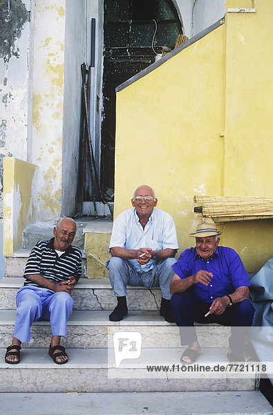 Senior Men Sitting On Steps  Chiaorella  Procida  Italy