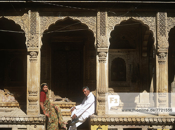Man And Woman Outside Historical Building  India