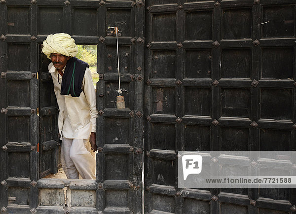 Man Peeking From Doorway  Rajasthan  India