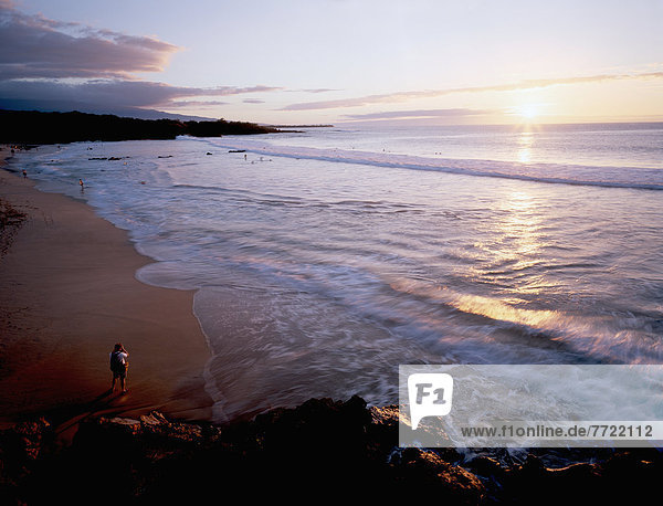 Hawaii  Big Island  South Kohala  Hapuna Beach  Tourist Takes Photograph Of The Sunset On A Gorgeous Beach.