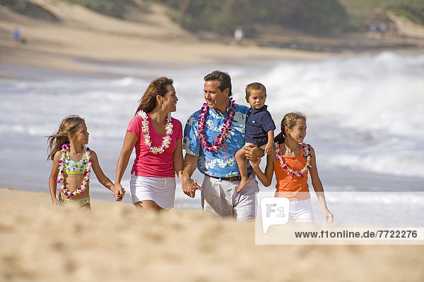 Hawaii  Maui  Baldwin Beach  Family On Vacation Walking Down The Beach.