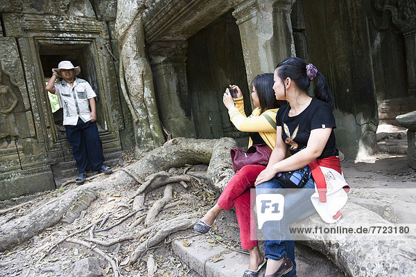Tourists Taking Photo At Temple Of Ta Prohm  Siem Reap  Cambodia