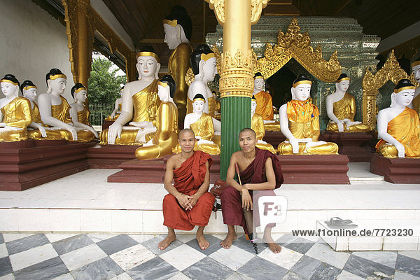 Two Monks Sitting Inside Shwedagon Pagoda  Portrait  Rangoon  Burma