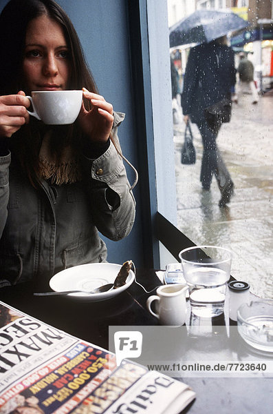 Woman Drinking Coffee At Coffee Shop  London  England