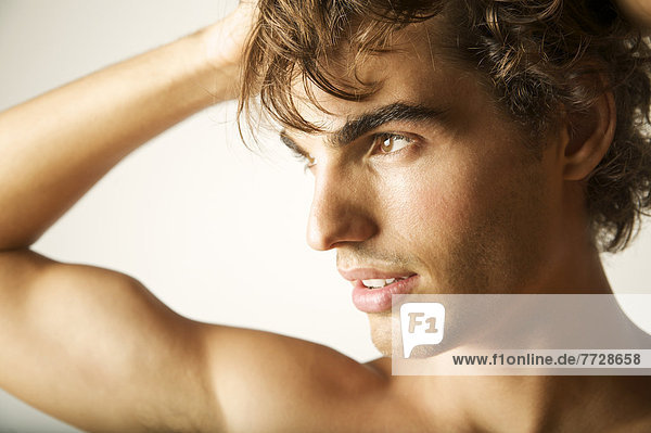Young Models Closeup Poses Touching Her Shoulder Stock Photo - Download  Image Now - 20-24 Years, 20-29 Years, 2015 - iStock