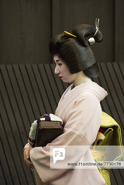 Geisha Walking In A Street  Kyoto  Japan