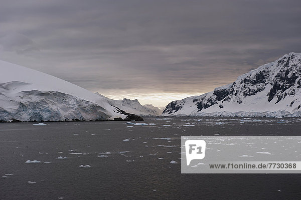 Mountains Along The Coastline At Sunset  Antarctica