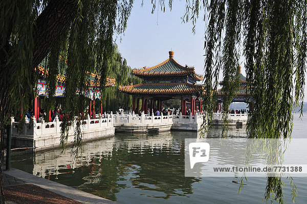 Buildings Reflected In A Tranquil Lake  Beijing China