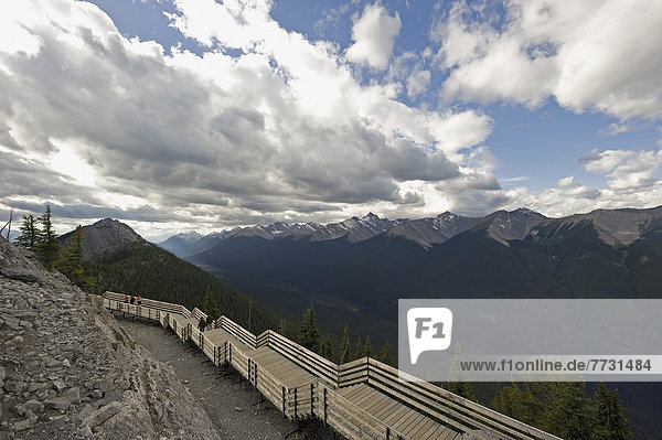 People On A Wooden Boardwalk Along A Ridge Of The Canadian Rocky Mountains  Alberta Canada