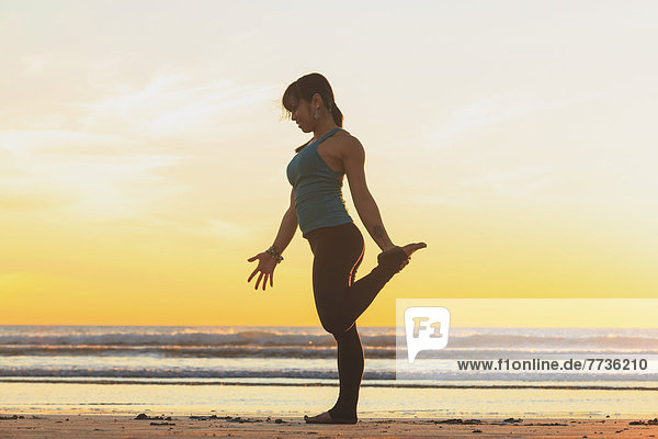 Woman Practising Yoga Near Pacific Beach  San Diego California United States Of America