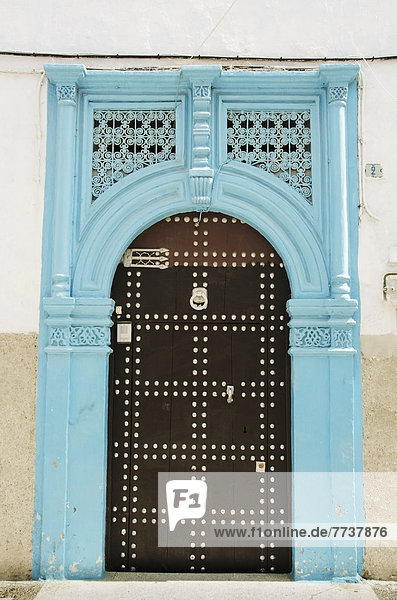 A bright blue painted frame over an arch door in old medina Casablanca morocco