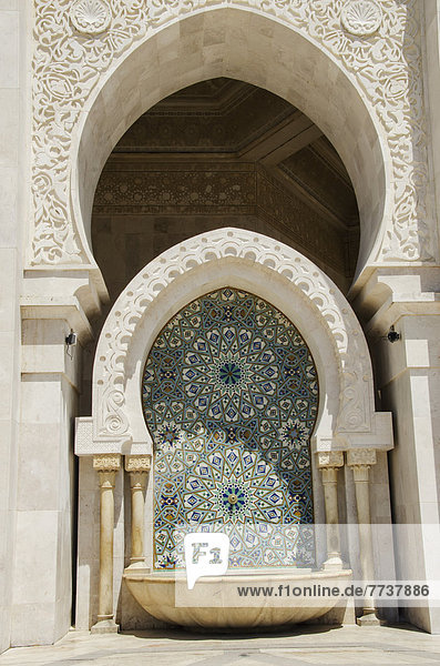 Ornate facade on the hassan ii mosque Casablanca morocco