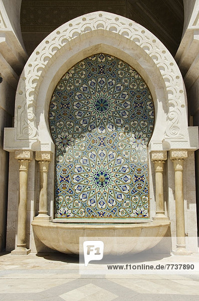 Decorative facade on an arched structure at hassan ii mosque Casablanca morocco