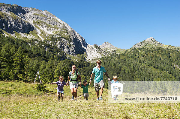 Austria  Salzburg  Family walking on mountains at Altenmarkt Zauchensee