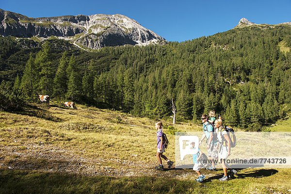 Austria  Salzburg  Family walking on mountains at Altenmarkt Zauchensee