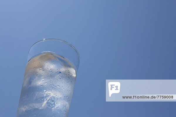 Glass of water and blue sky