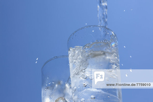 Two glasses of water and blue sky