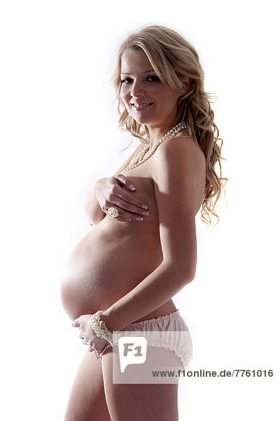 Schwangere Frau mit Hand auf dem Bauch