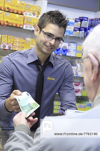 France  drugstore  pharmacist with a customer
