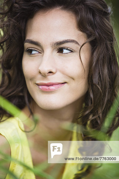 Portrait of young smiling woman  outdoors