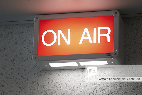 '''On air'' sign at the entrance to a radio studio'