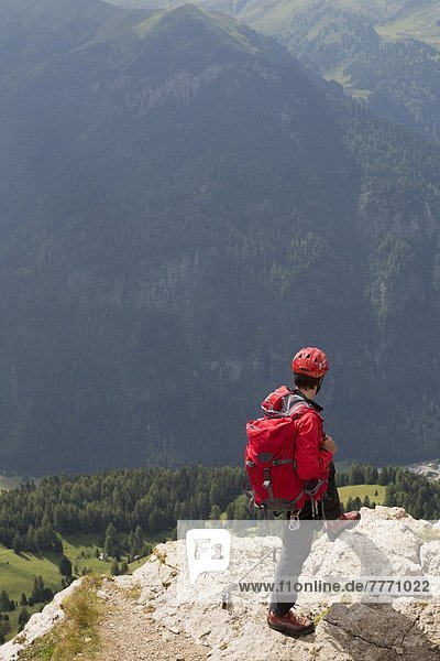 Climbers on the Sassolungo mountains in the Dolomites near Canazei  Italy  Europe