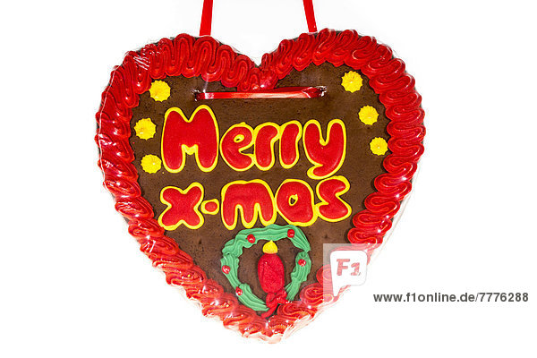 'Gingerbread heart with the writing ''Merry X-mas'''