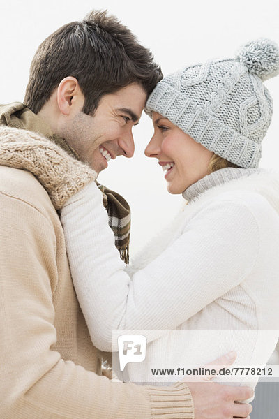 Profile of couple in winter clothing