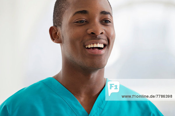 Portrait of young man wearing surgical scrubs