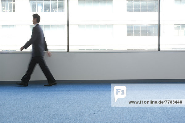 Businessman walking through the office