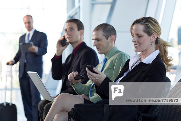 Mature businesswoman using cell phone