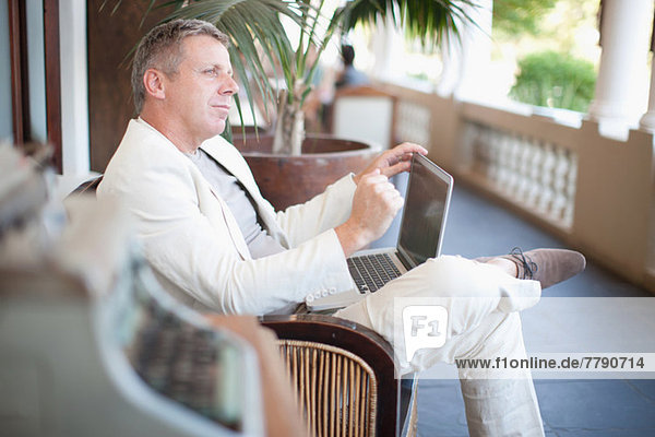 Casual businessman using laptop