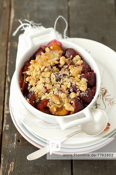 Plum Crumble in Individual Baking Dish; Spoon