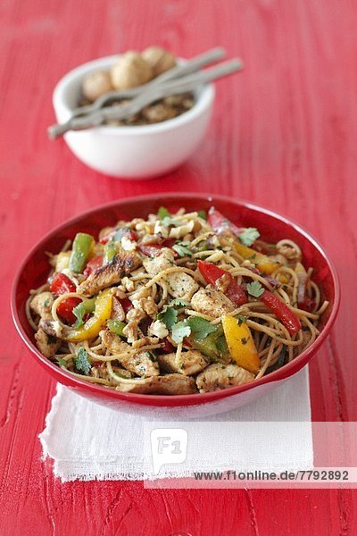 Wholemeal spaghetti with turkey  peppers  parsley and walnuts
