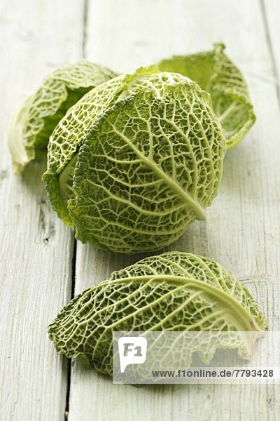 Head of savoy cabbage and leaves
