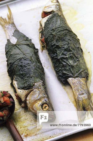 Trout wrapped in vine leaves