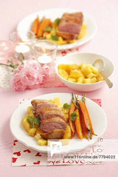 Duck breast with pineapple  oranges and baby carrots