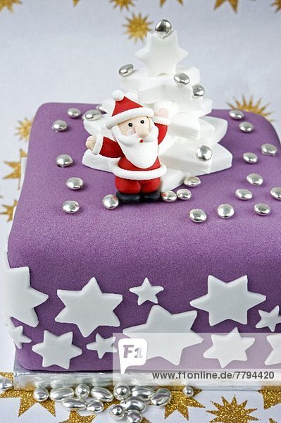 Weihnachtsmann hoch oben sternförmig Modell halten weiß lila Eiscreme Eis Sterne