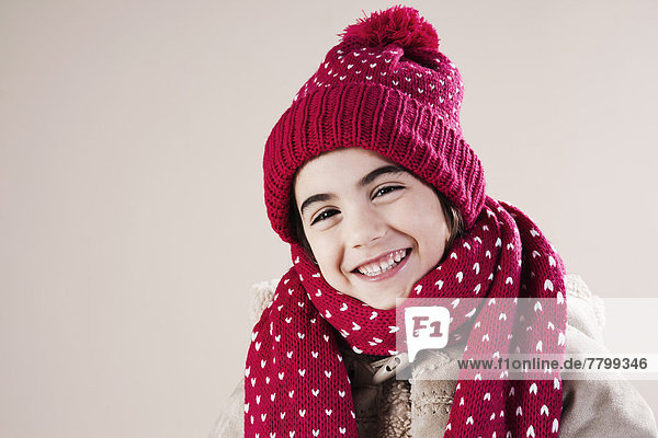 Portrait of Girl wearing Hat and Scarf in Studio