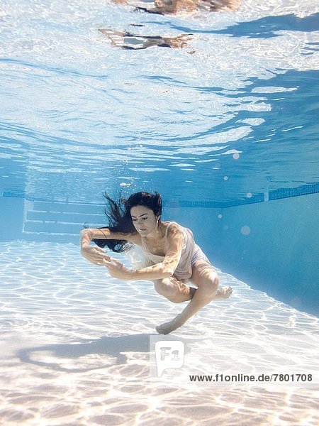 USA Utah Orem Young woman in pool ballet dancing
