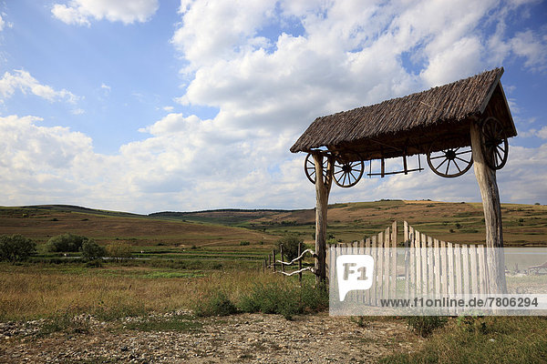 Transylvanian wooden gate at the entrance to a farm estate